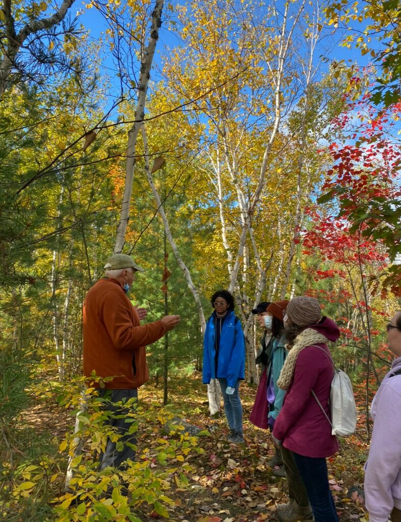 Students on a guided nature walk in a woodland in Sudbury Canada.